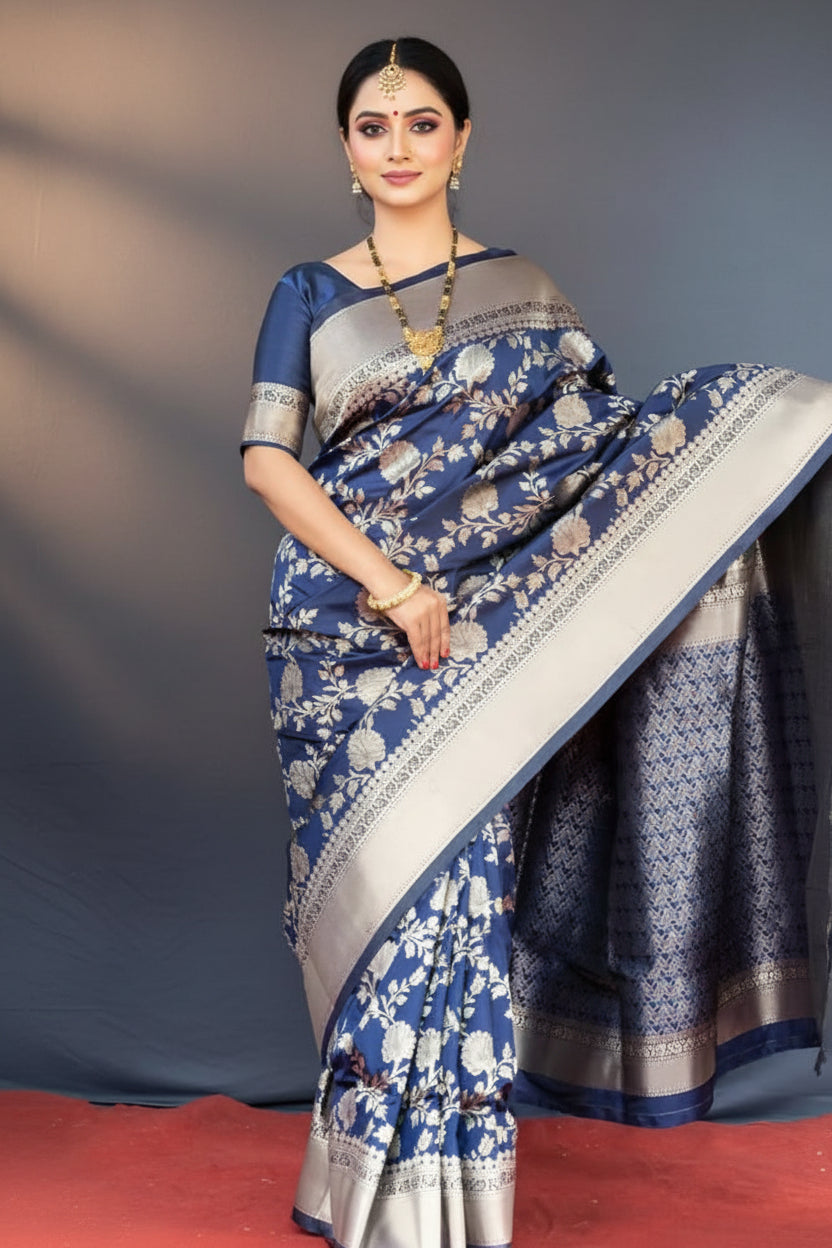 Close-up portrait of model wearing navy blue Banarasi silk saree showing zari floral jaal