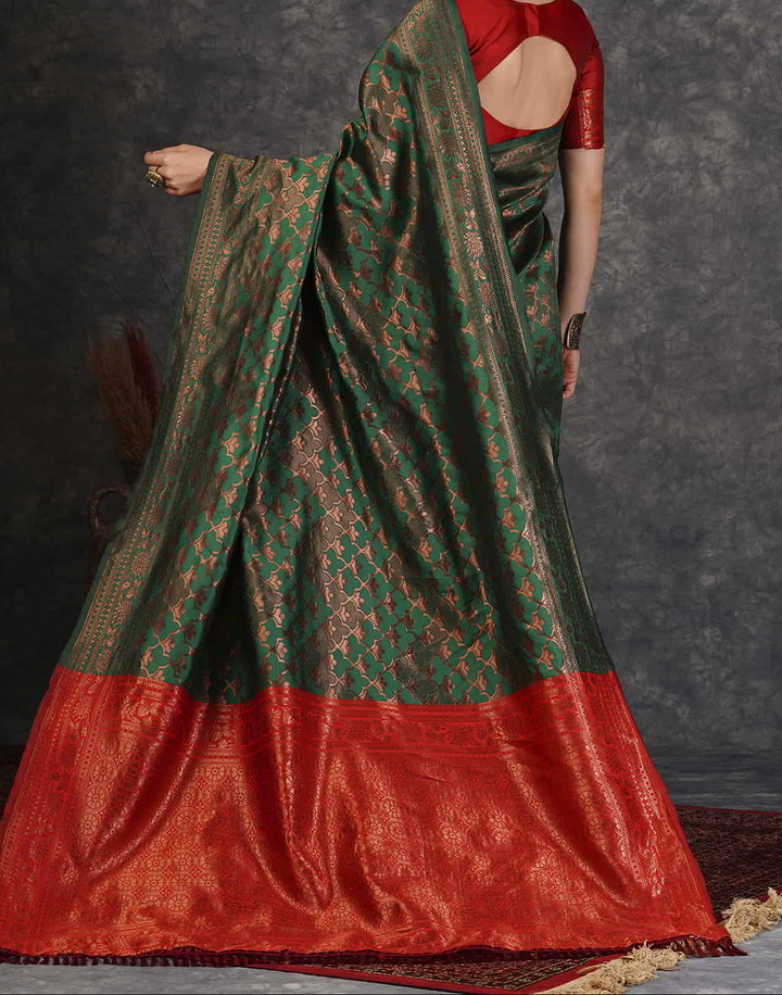 Close-up portrait of model in red silk blouse with copper zari floral sleeve border and round neck design