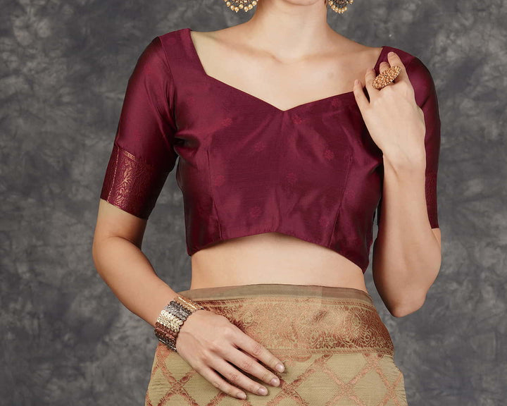 Flat lay close-up of golden beige Banarasi silk saree body showing all-over copper zari diamond lattice jaal with paisley buttas