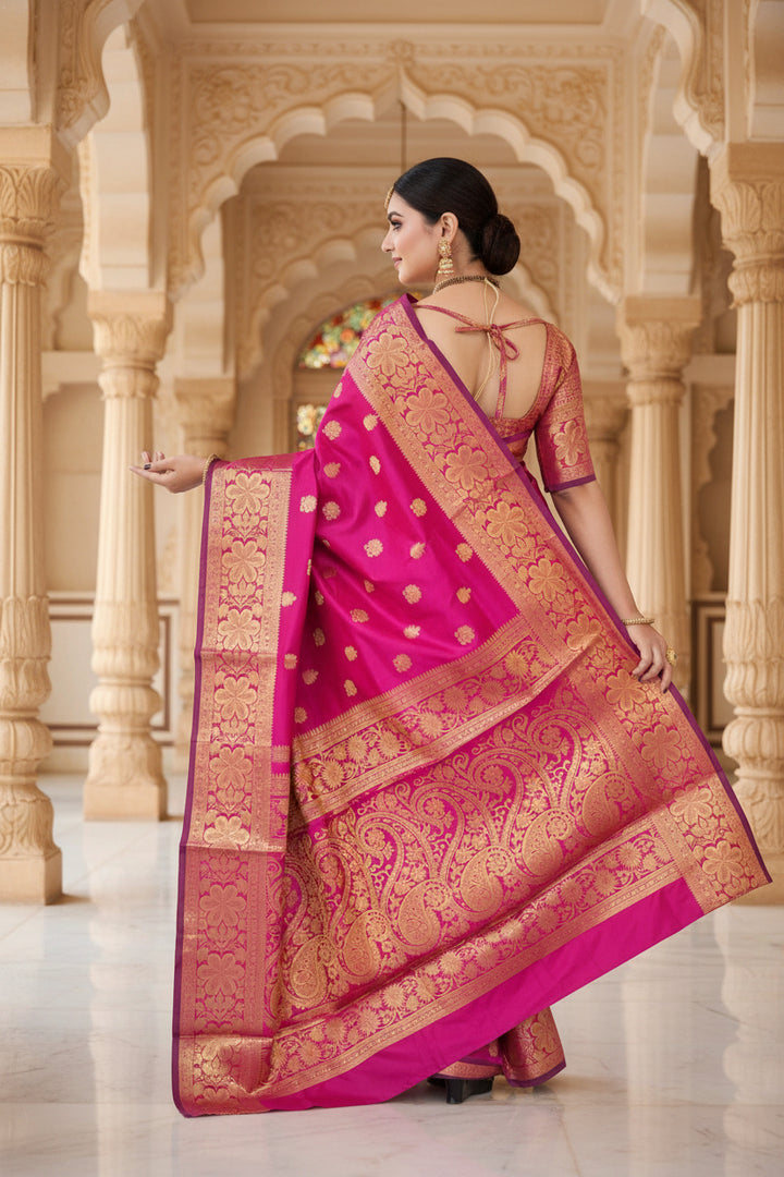 Back view of model in rani pink Banarasi silk saree showing grand gold zari jaal pallu