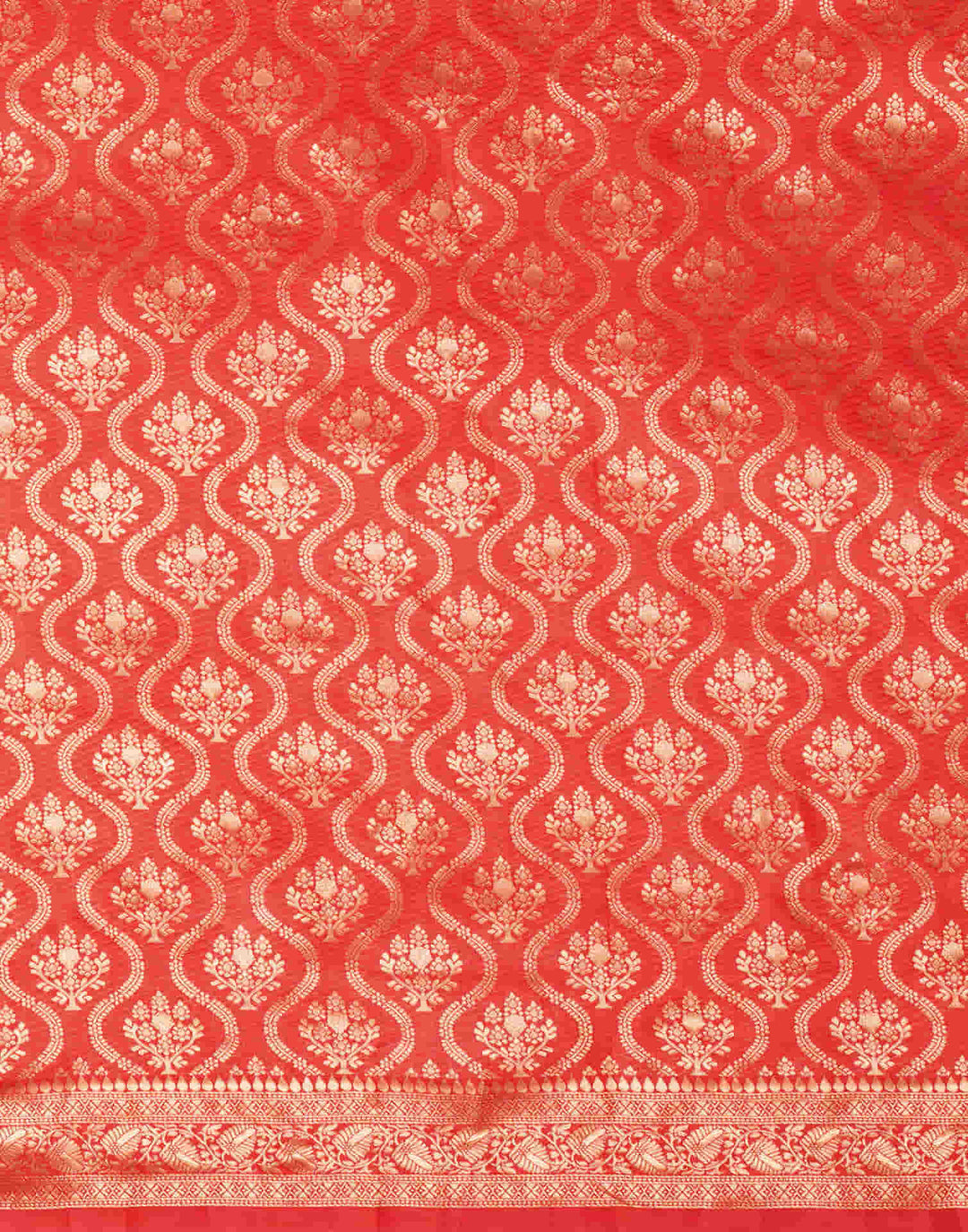 Blouse flat-lay illustration of red silk blouse with gold zari temple sleeve border and round neck design