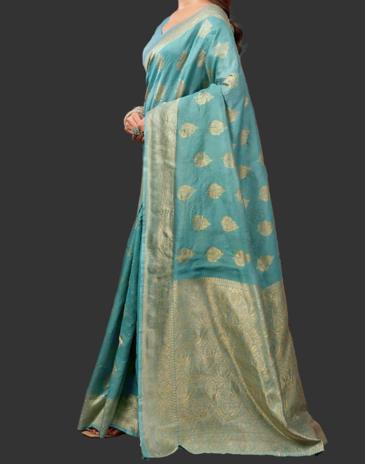 Back view showing gold zari buttas and pallu