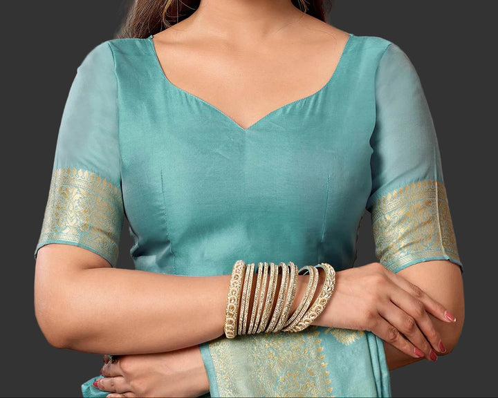 Teal silk blouse with gold zari sleeve border and V-neck