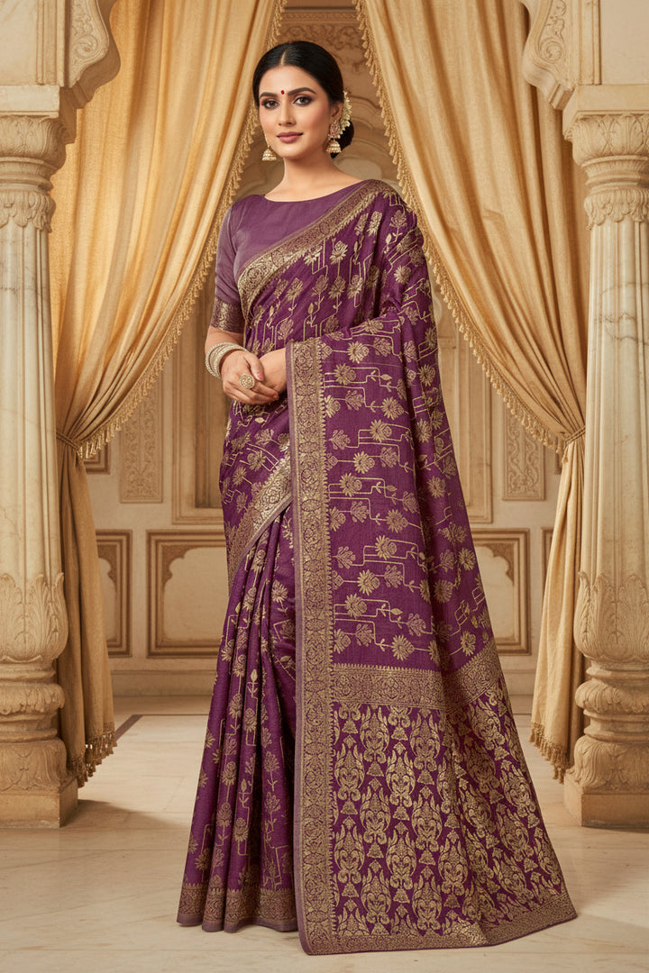 Full front view of model in wine purple Banarasi silk saree with gold zari sunflower vine buttas and antique gold border