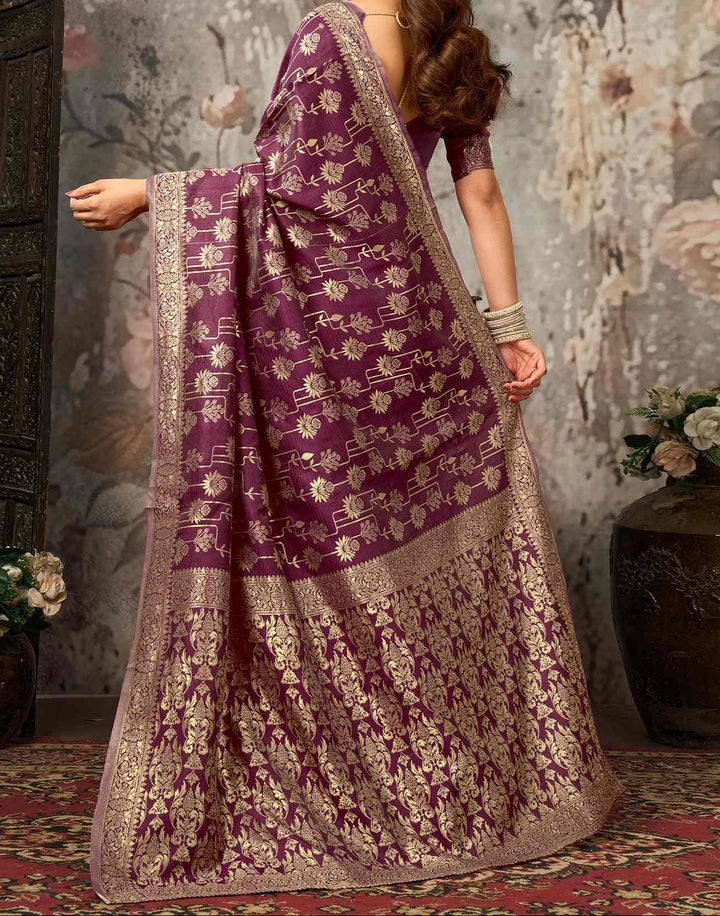 Close-up portrait of model in wine purple silk blouse with antique gold zari floral sleeve border and round neck