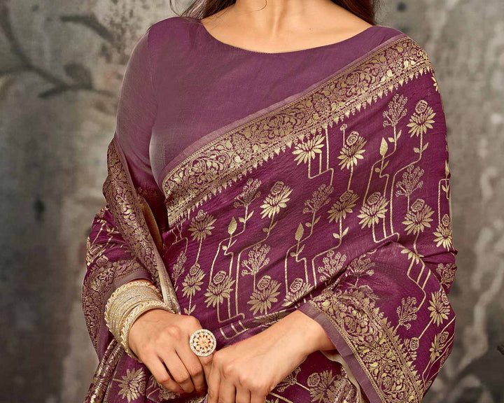 Flat lay close-up of wine purple Banarasi silk saree pallu showing dense all-over gold zari floral and paisley jaal weave