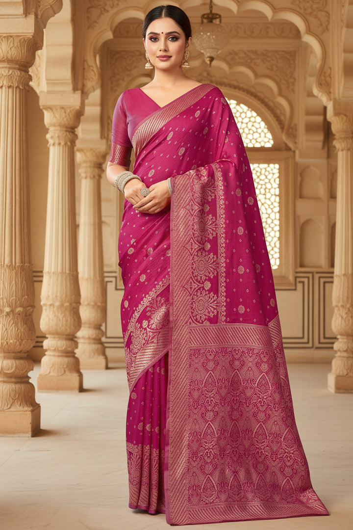 Side view of model in magenta Banarasi silk saree showing all-over gold zari diamond jaal weave and grand arch pallu