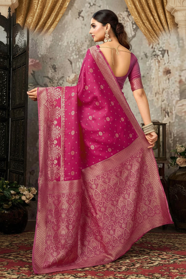 Full front view of model in magenta Banarasi silk saree with gold zari diamond jaal and diagonal stripe border