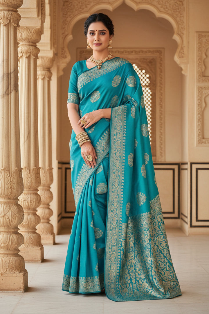 Back view of model in cerulean blue Banarasi silk saree showing grand gold zari jaal pallu and open back blouse