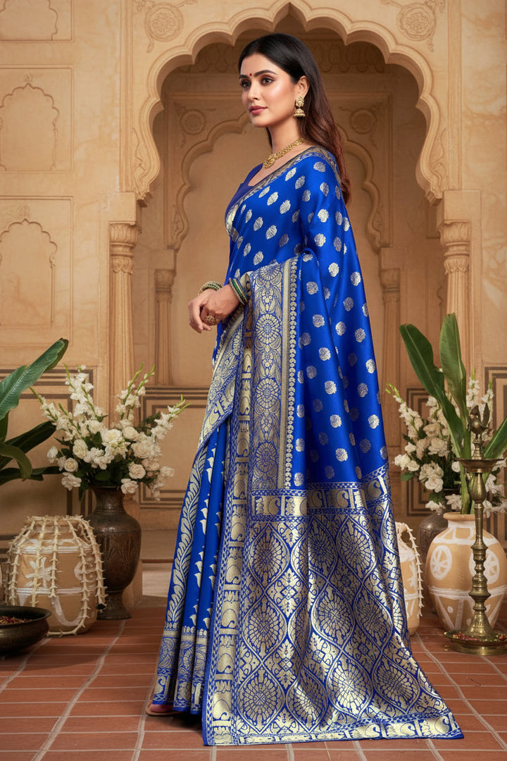 Back view of model in royal blue Banarasi silk saree showing open back blouse and grand gold zari diamond jaal pallu