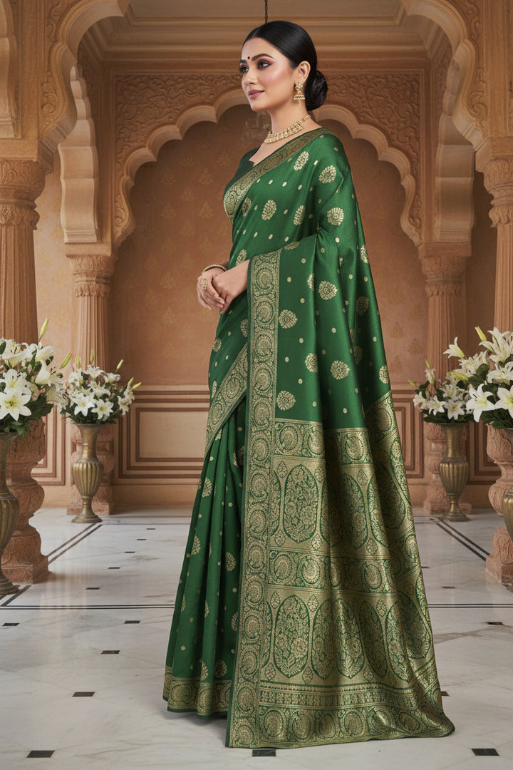 Back view of model in bottle green Banarasi silk saree showing grand gold zari pallu