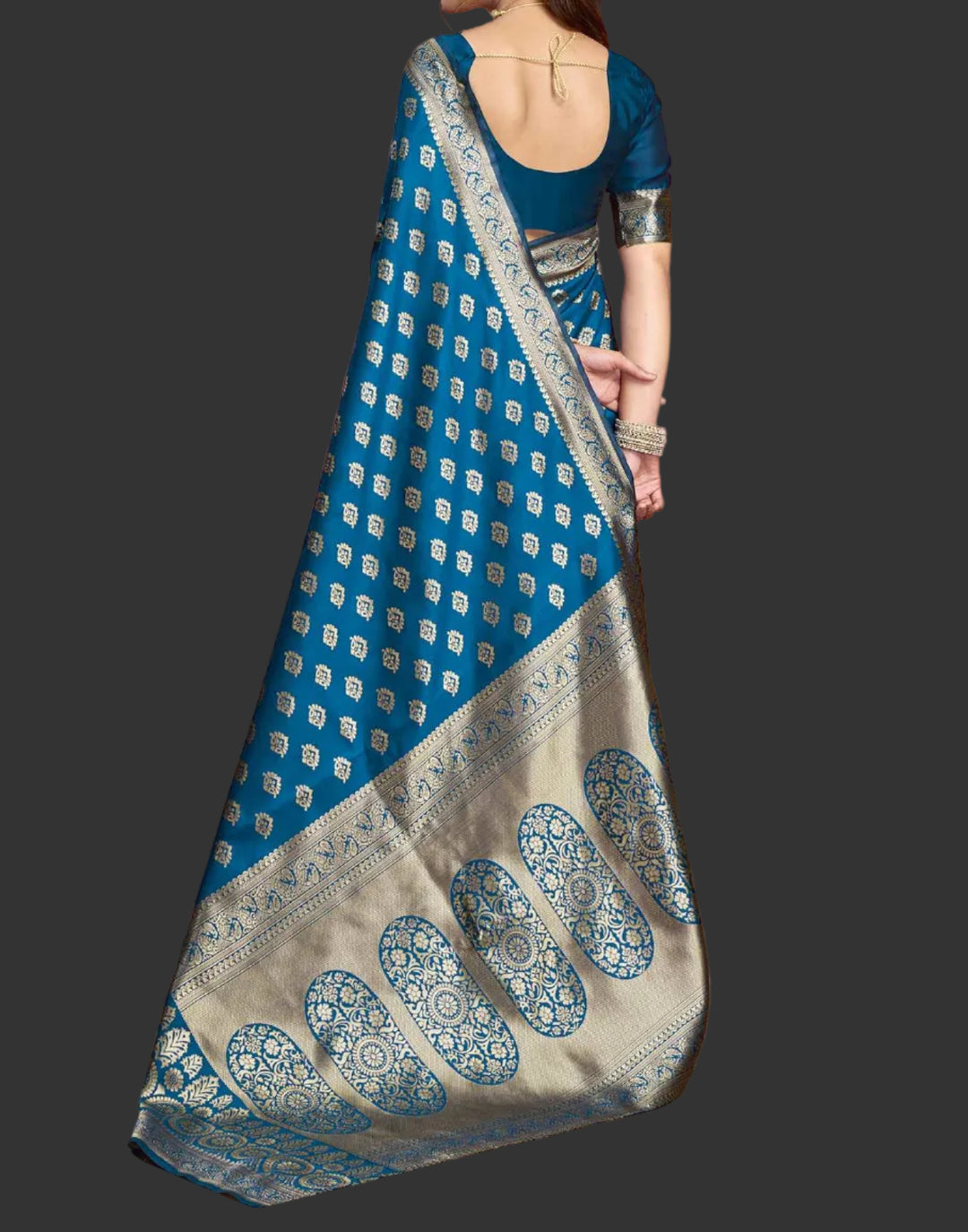 Full front view of model in peacock blue Banarasi silk saree showing broad antique gold zari border