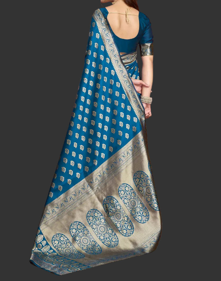 Full front view of model in peacock blue Banarasi silk saree showing broad antique gold zari border