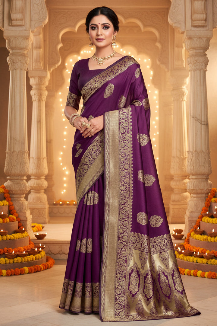 Full front view of model in deep purple Banarasi silk saree with gold zari oval buttas and antique gold border
