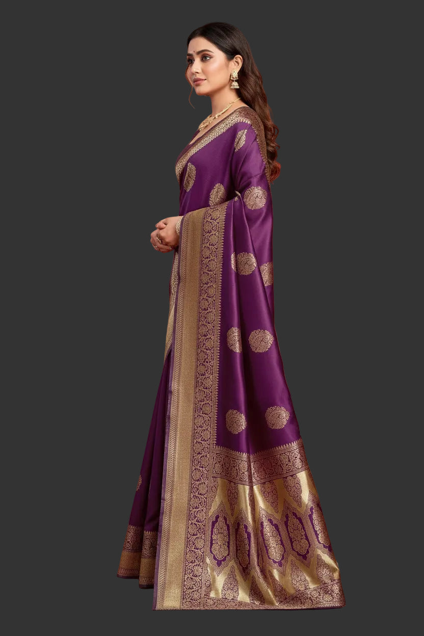 Side profile of model in deep purple Banarasi silk saree showing drape and grand antique gold arch pallu