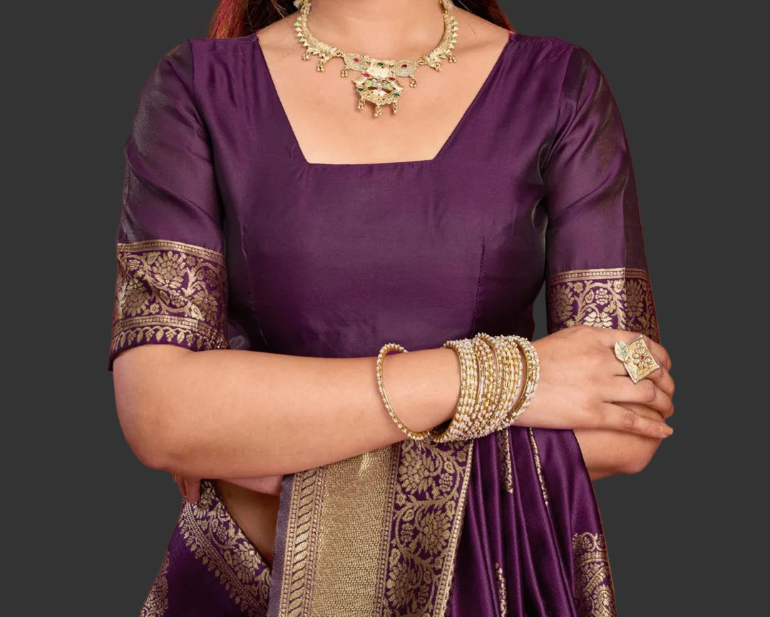Close-up portrait of model in deep purple Banarasi silk blouse with antique gold zari floral sleeve border and square neck