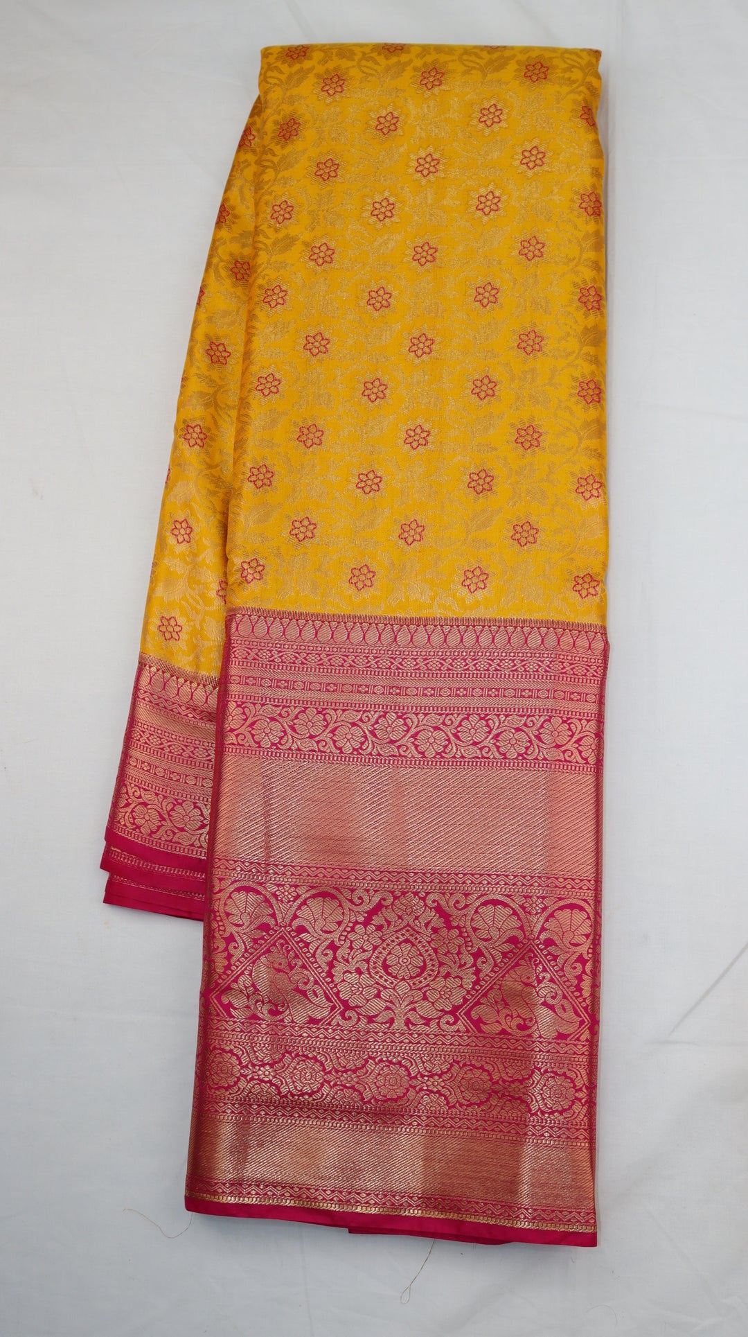 Turmeric Yellow Pure Kanchipuram Silk Saree with Pink Floral Zari Weaving &amp; Contrast Pink Border