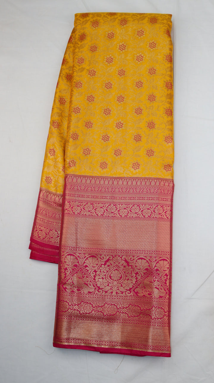 Turmeric Yellow Pure Kanchipuram Silk Saree with Pink Floral Zari Weaving &amp; Contrast Pink Border