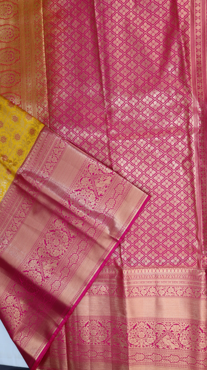 Turmeric Yellow Pure Kanchipuram Silk Saree with Pink Floral Zari Weaving &amp; Contrast Pink Border