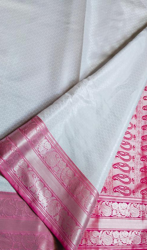 White and Pink Kanjipuram Silk Saree - Folded view showing pink zari border