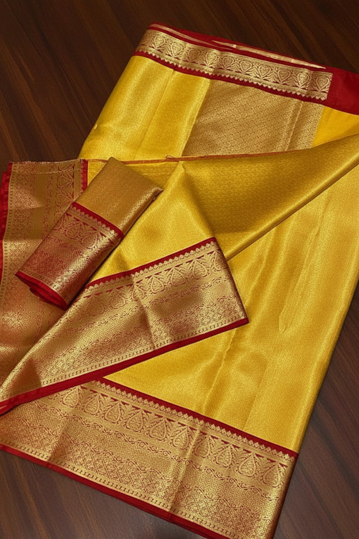 Yellow Kanjipuram Silk Saree with Broad Red Border &amp; Dense Gold Zari Paisley Weave