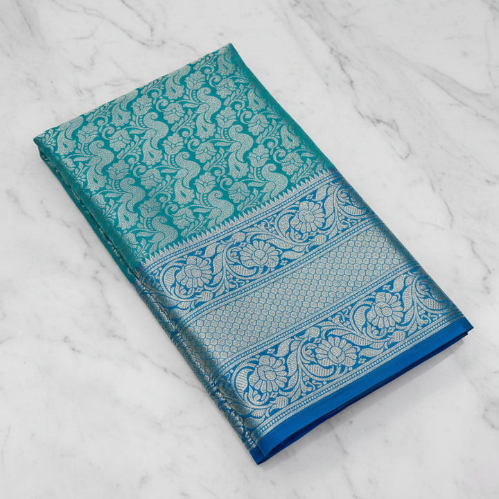 Teal Green Banarasi Silk Saree with All-Over Silver Zari Peacock Jaal &amp; Royal Blue Border