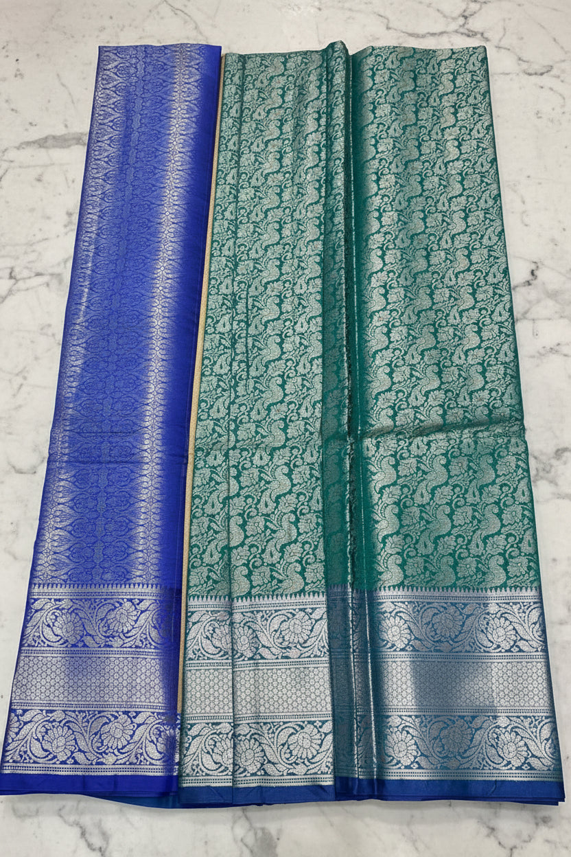 Teal Green Banarasi Silk Saree with All-Over Silver Zari Peacock Jaal &amp; Royal Blue Border