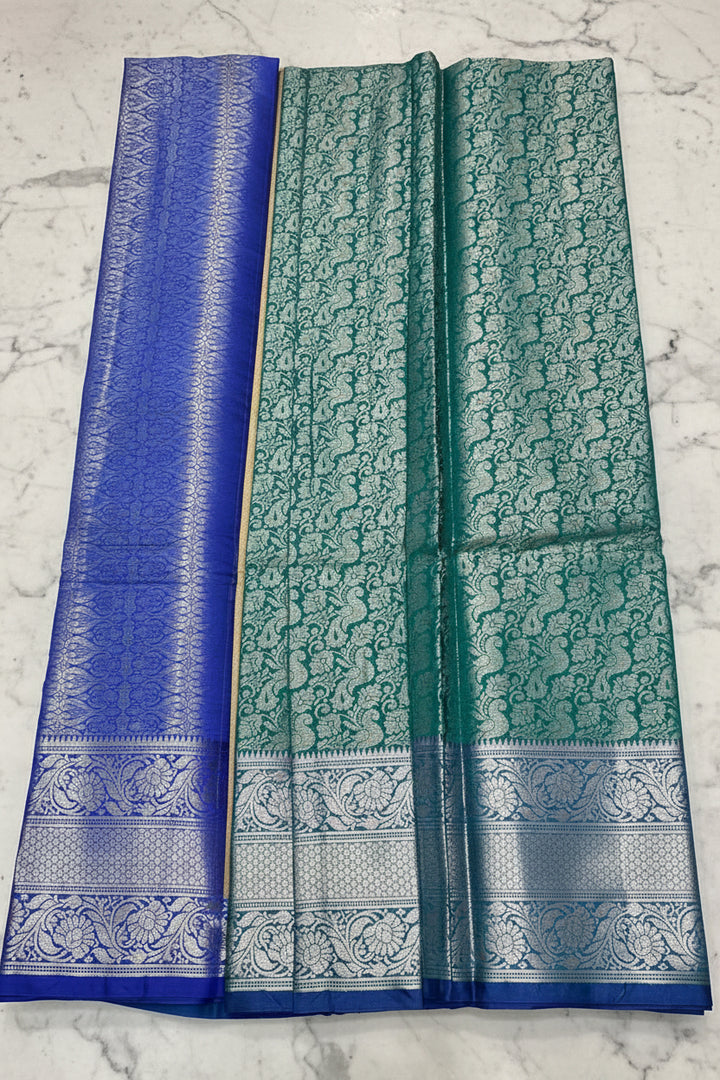 Teal Green Banarasi Silk Saree with All-Over Silver Zari Peacock Jaal &amp; Royal Blue Border