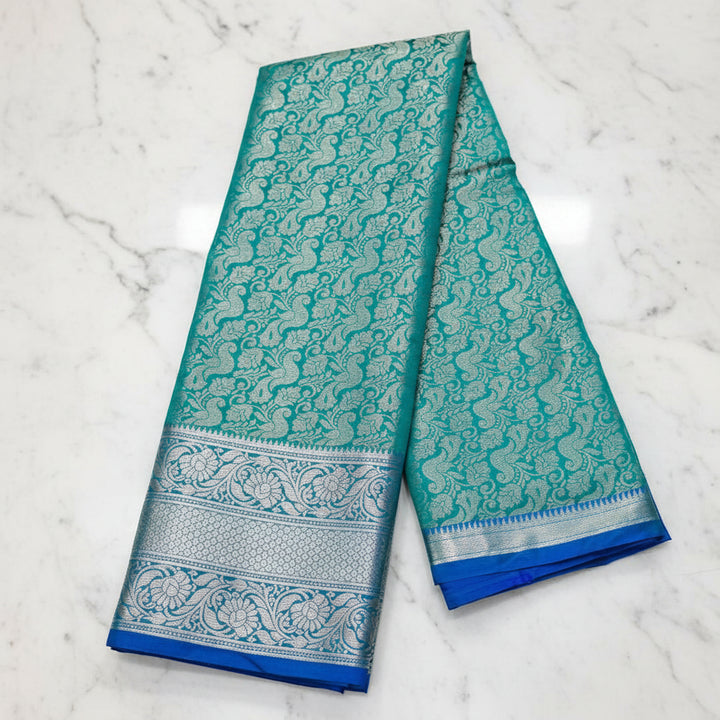 Teal Green Banarasi Silk Saree with All-Over Silver Zari Peacock Jaal &amp; Royal Blue Border