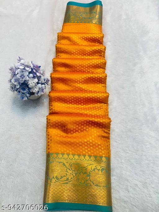 Orange Saree with Gold Floral Border and Teal Trim