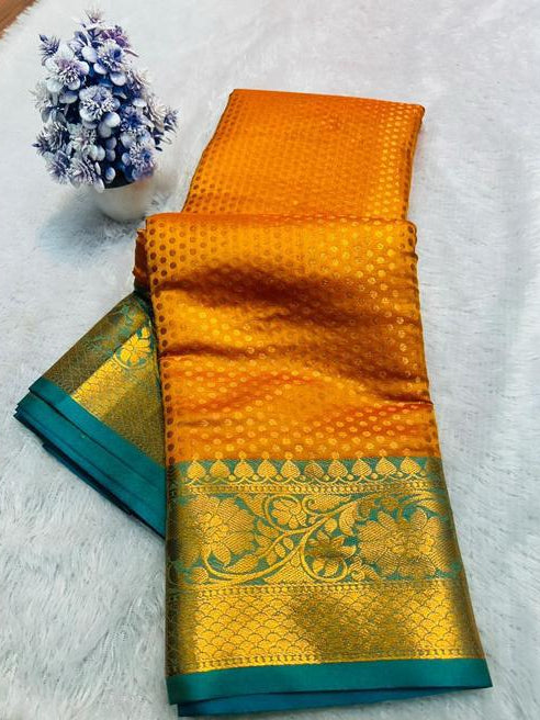 Orange Saree with Gold Floral Border and Teal Trim