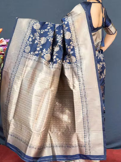 Model wearing navy blue Banarasi silk saree - back view showing heavily woven silver zari pallu