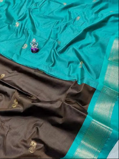 Brown Kanjipuram silk saree folded showing teal border and gold zari motifs