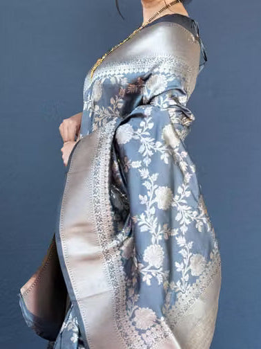 Model wearing steel grey Banarasi silk saree - side profile view showing pallu