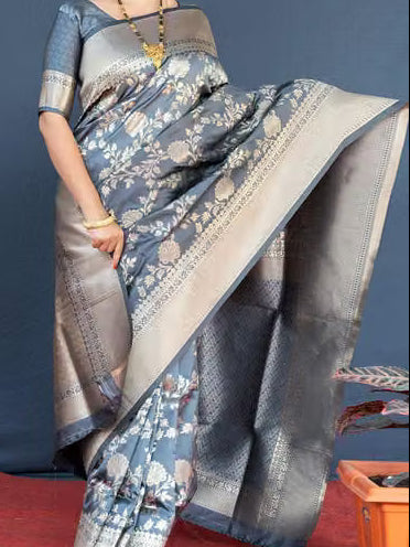 Close-up portrait of model wearing steel grey Banarasi silk saree and blouse