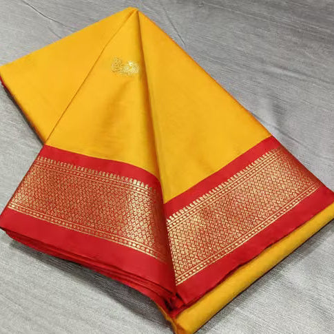 Yellow and red silk saree with zari border - draped view